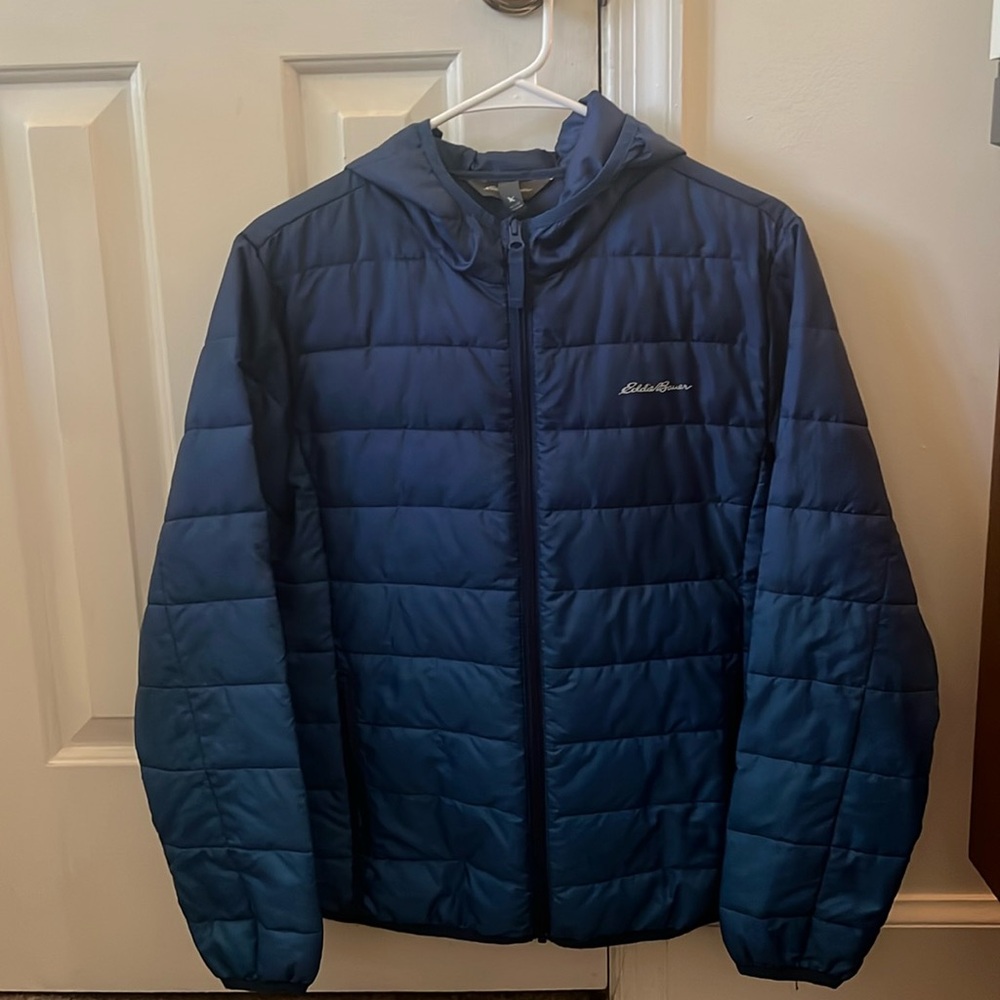 Youth synthetic fill puffy jacket with hood.